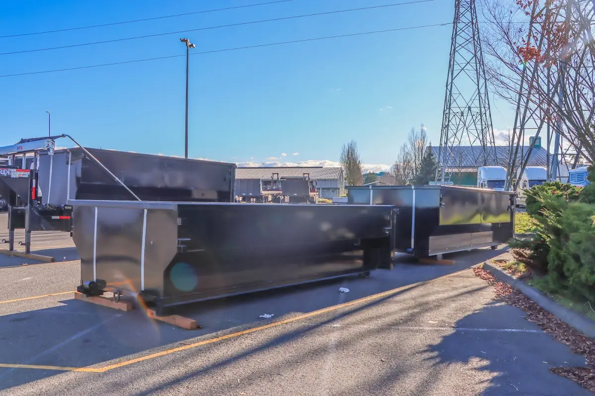 Roll-off dumpster ready for waste disposal at job site for 12 Yard Dumpster Rental in Alpine